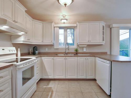 Cuisine - 136 Rue Louise, L'Épiphanie, QC - Indoor Photo Showing Kitchen With Double Sink