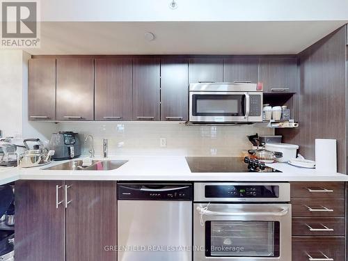 709 W - 565 Wilson Avenue, Toronto, ON - Indoor Photo Showing Kitchen With Double Sink