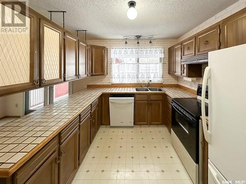 133 2Nd Street W, Lafleche, SK - Indoor Photo Showing Kitchen With Double Sink