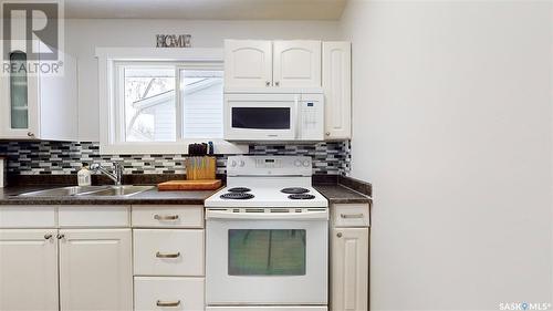 6814 1St Avenue N, Regina, SK - Indoor Photo Showing Kitchen With Double Sink