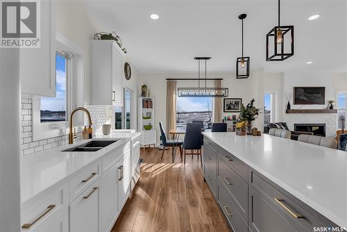 68 Meadowlark Crescent, Blucher Rm No. 343, SK - Indoor Photo Showing Kitchen With Fireplace With Double Sink