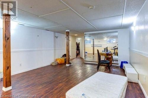 Workout area with dark wood-type flooring - 539 Briarwood Avenue, Listowel, ON - Indoor Photo Showing Other Room