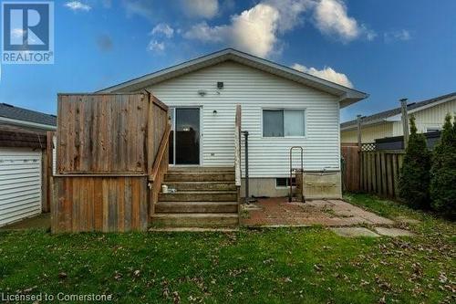 Back of house with a lawn - 539 Briarwood Avenue, Listowel, ON - Outdoor With Exterior