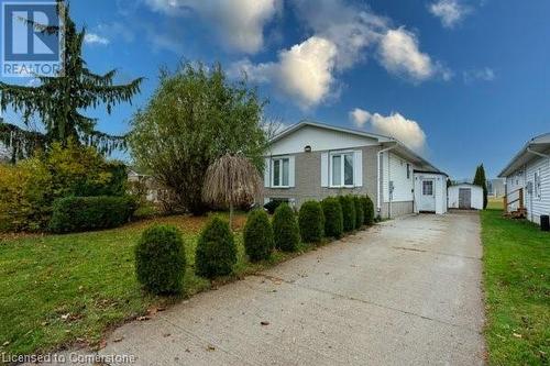 View of side of property featuring a yard - 539 Briarwood Avenue, Listowel, ON - Outdoor