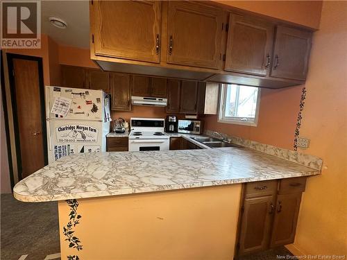 17 Colette Street, Charlo, NB - Indoor Photo Showing Kitchen With Double Sink