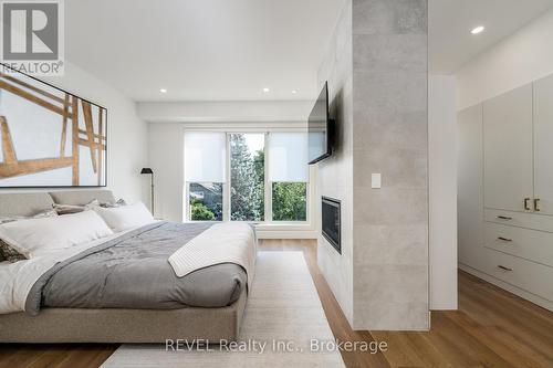 10 - 1397 York Road, Niagara-On-The-Lake, ON - Indoor Photo Showing Bedroom With Fireplace