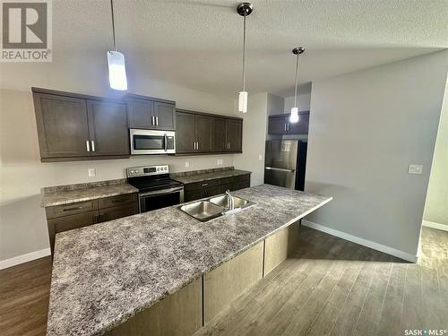 6264 Little Pine Loop, Regina, SK - Indoor Photo Showing Kitchen With Stainless Steel Kitchen With Double Sink With Upgraded Kitchen