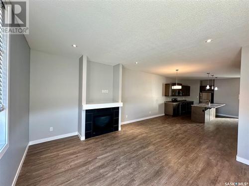 6264 Little Pine Loop, Regina, SK - Indoor Photo Showing Other Room With Fireplace