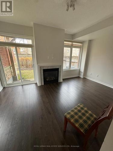 17 - 5710 Long Valley Road, Mississauga, ON - Indoor Photo Showing Living Room With Fireplace