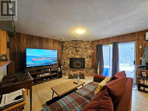 4975 Plateau Road, 108 Mile Ranch, BC - Indoor Photo Showing Living Room With Fireplace