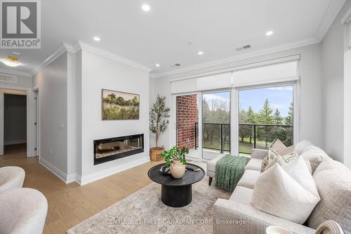 Living room with linear electric fireplace - 310 - 1560 Upper West Avenue, London, ON - Indoor Photo Showing Living Room With Fireplace