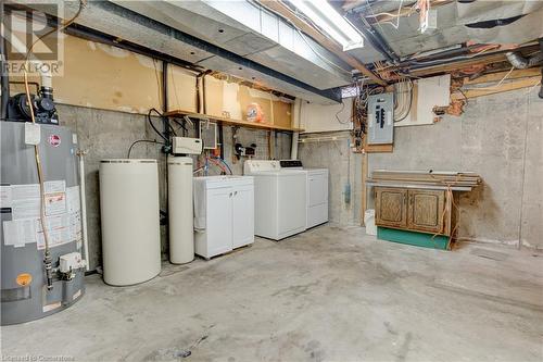 Basement featuring electric panel, gas water heater, and washing machine and dryer - 116 Glamis Road, Cambridge, ON - Indoor Photo Showing Laundry Room