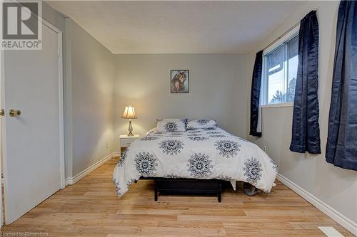 Bedroom with light wood-type flooring and a textured ceiling - 116 Glamis Road, Cambridge, ON - Indoor Photo Showing Bedroom