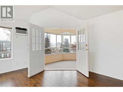 French double doors out to enclosed Sunroom/Deck - 985 Klo Road Unit# 319, Kelowna, BC - Indoor Photo Showing Other Room