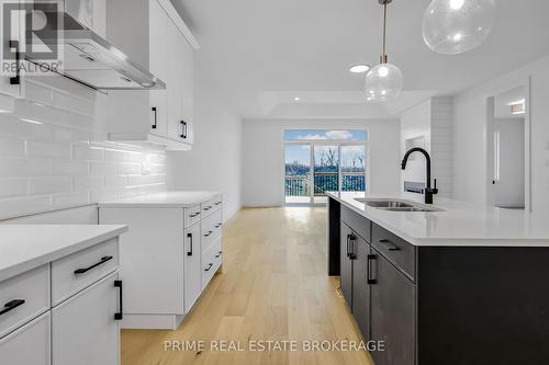 51 - 10 Coastal Crescent, Lambton Shores (Grand Bend), ON - Indoor Photo Showing Kitchen With Double Sink