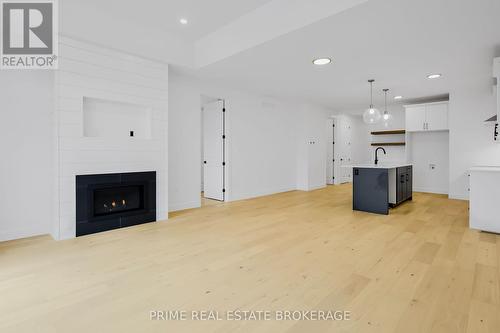 51 - 10 Coastal Crescent, Lambton Shores (Grand Bend), ON - Indoor Photo Showing Living Room With Fireplace