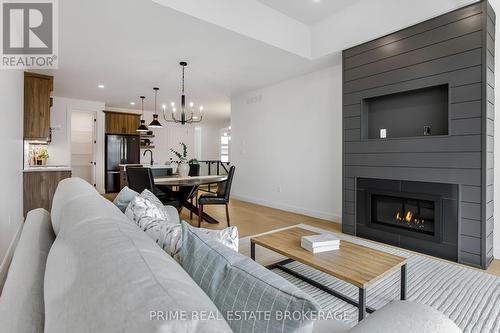 49 - 14 Coastal Crescent, Lambton Shores (Grand Bend), ON - Indoor Photo Showing Living Room With Fireplace