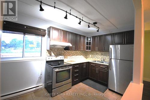 67 - 180 Mississauga Valley Boulevard, Mississauga, ON - Indoor Photo Showing Kitchen With Stainless Steel Kitchen With Double Sink