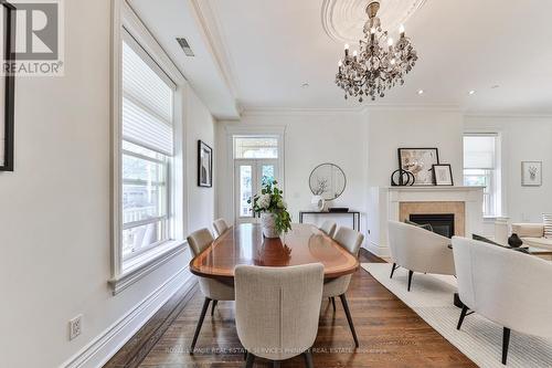 5 - 32 Gothic Avenue, Toronto, ON - Indoor Photo Showing Dining Room With Fireplace