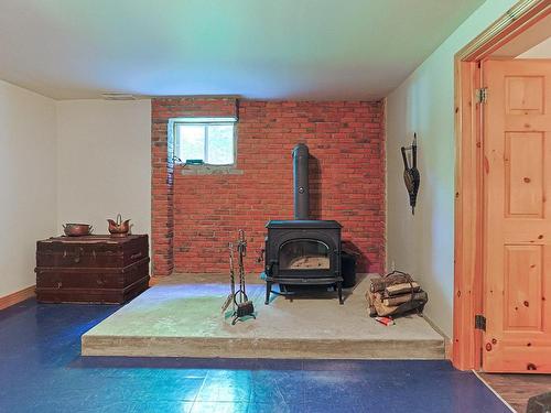 Family room - 60 Rue Lacombe, Notre-Dame-De-Lourdes, QC - Indoor With Fireplace