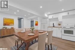 Dining space with sink and light wood-type flooring - 