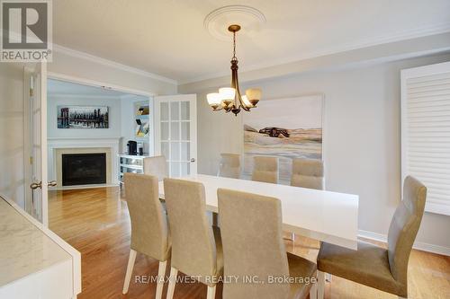 6 - 2145 Country Club Drive E, Burlington, ON - Indoor Photo Showing Dining Room With Fireplace