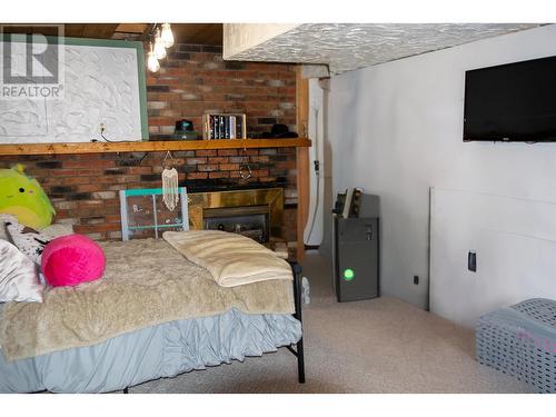 1344 Lakeview Drive, Quesnel, BC - Indoor Photo Showing Bedroom With Fireplace