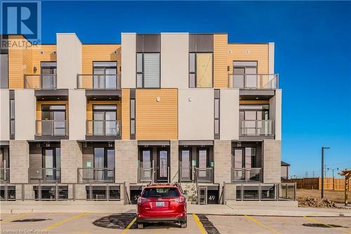 View of building exterior - 142 Foamflower Place Unit# D053, Waterloo, ON - Outdoor With Facade