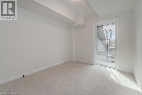 Additional living space with carpet flooring - 142 Foamflower Place Unit# D053, Waterloo, ON - Indoor Photo Showing Other Room