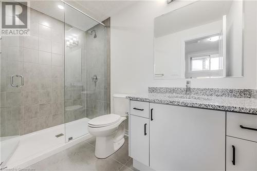 Bathroom featuring tile patterned floors, vanity, toilet, and walk in shower - 142 Foamflower Place Unit# D053, Waterloo, ON - Indoor Photo Showing Bathroom