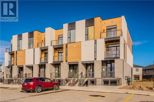 View of building exterior - 142 Foamflower Place Unit# D053, Waterloo, ON - Outdoor With Facade