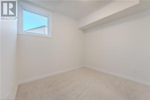 Spare room featuring carpet floors - 142 Foamflower Place Unit# D053, Waterloo, ON - Indoor Photo Showing Other Room