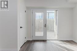 Doorway to outside with light hardwood / wood-style floors - 