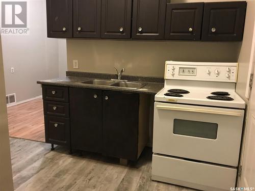 301 Cheadle Street E, Swift Current, SK - Indoor Photo Showing Kitchen With Double Sink