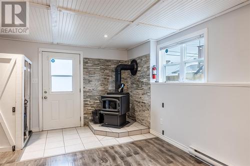 84 Hibbs Road, Conception Bay South, NL - Indoor Photo Showing Other Room With Fireplace