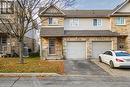 Townhome / multi-family property featuring a garage and central air condition unit - 169 Bismark Drive Unit# 32, Cambridge, ON  - Outdoor With Facade 