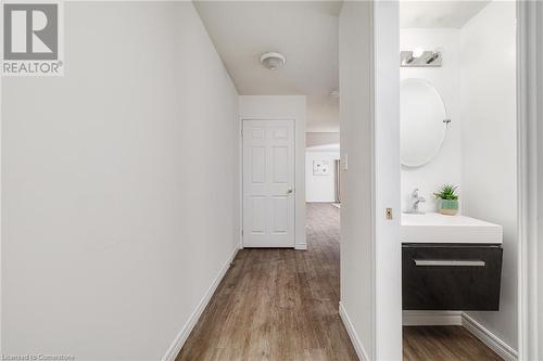 Corridor with sink and light hardwood / wood-style floors - 169 Bismark Drive Unit# 32, Cambridge, ON - Indoor