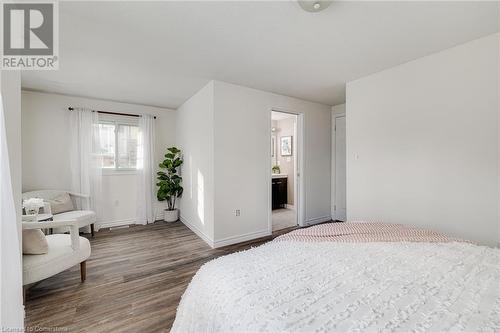 Bedroom with hardwood / wood-style flooring and ensuite bath - 169 Bismark Drive Unit# 32, Cambridge, ON - Indoor