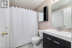 Bathroom featuring vanity and toilet - 