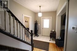 Entrance foyer with light hardwood / wood-style flooring - 