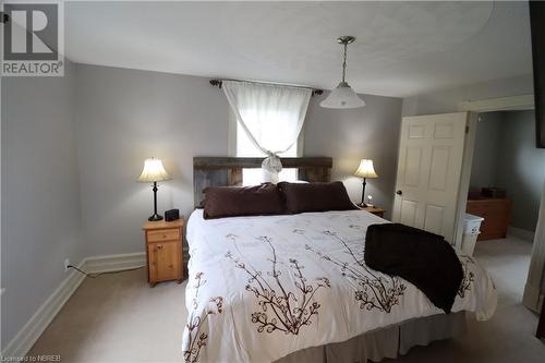 Bedroom featuring light carpet - 92 First Street, Sturgeon Falls, ON - Indoor Photo Showing Bedroom