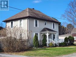 View of property with a front yard - 