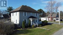 View of front of home featuring a front lawn - 