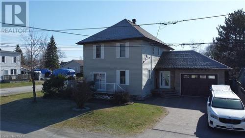 View of property exterior featuring a garage - 92 First Street, Sturgeon Falls, ON - Outdoor With Facade