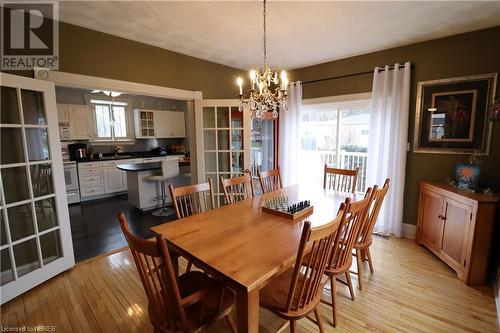 Dining area featuring light hardwood / wood-style flooring, a chandelier, and sink - 92 First Street, Sturgeon Falls, ON - Indoor Photo Showing Dining Room