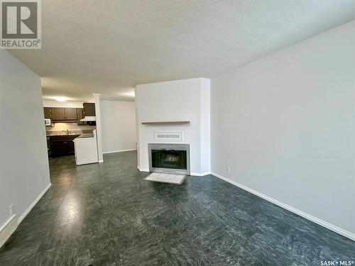 42 Cedar Meadow Drive, Regina, SK - Indoor Photo Showing Living Room With Fireplace