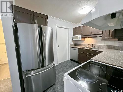 42 Cedar Meadow Drive, Regina, SK - Indoor Photo Showing Kitchen With Double Sink