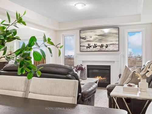 626 Laking Terr, Milton, ON - Indoor Photo Showing Living Room With Fireplace