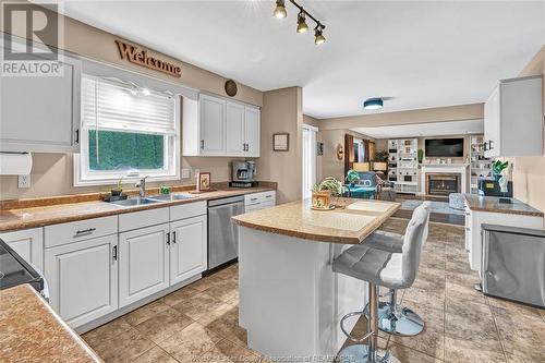 162 Martin, Lakeshore, ON - Indoor Photo Showing Kitchen With Fireplace With Double Sink