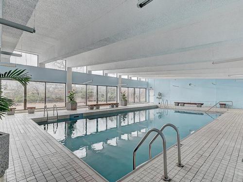 Piscine - 104-1550 Av. Panama, Brossard, QC - Indoor Photo Showing Other Room With In Ground Pool